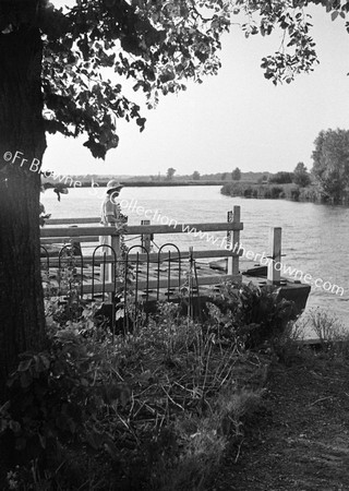 LADY WAITING FOR FERRY